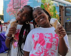 Kids with braids eating ice cream. 